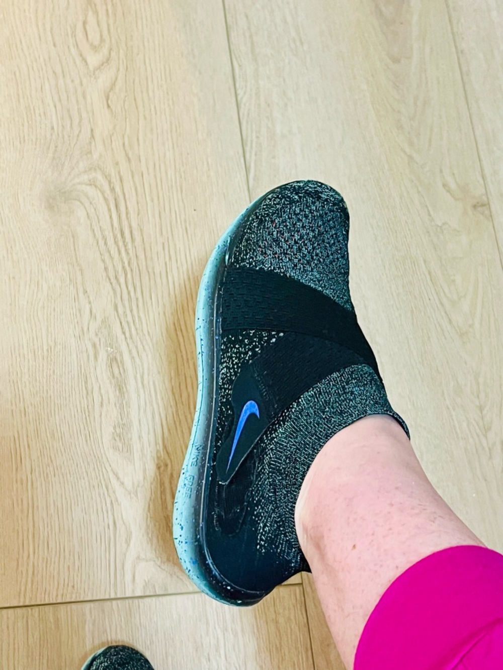 Nike Women’s Black Knit Slip-On Running Shoe with Blue Swoosh